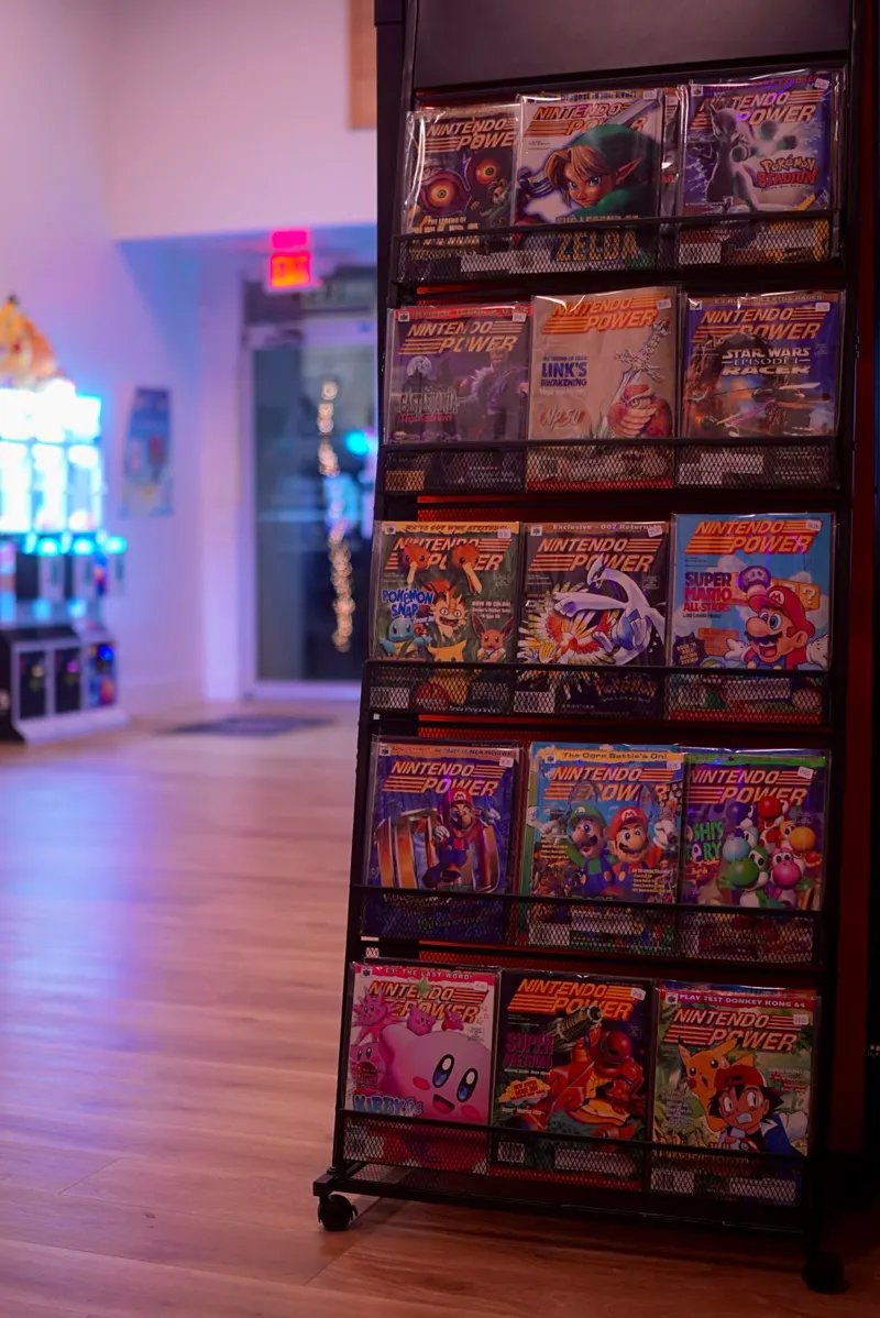 A rack of boxed Super Nintendo and Nintendo 64 games